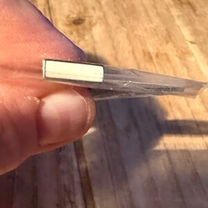 White color bar set in silver, keep collective charm